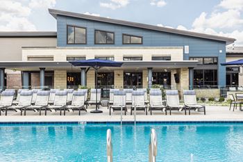Outdoor swimming pool with sun loungers